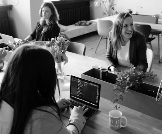 Image of people working on desk