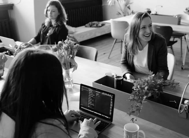 Image of people working on desk